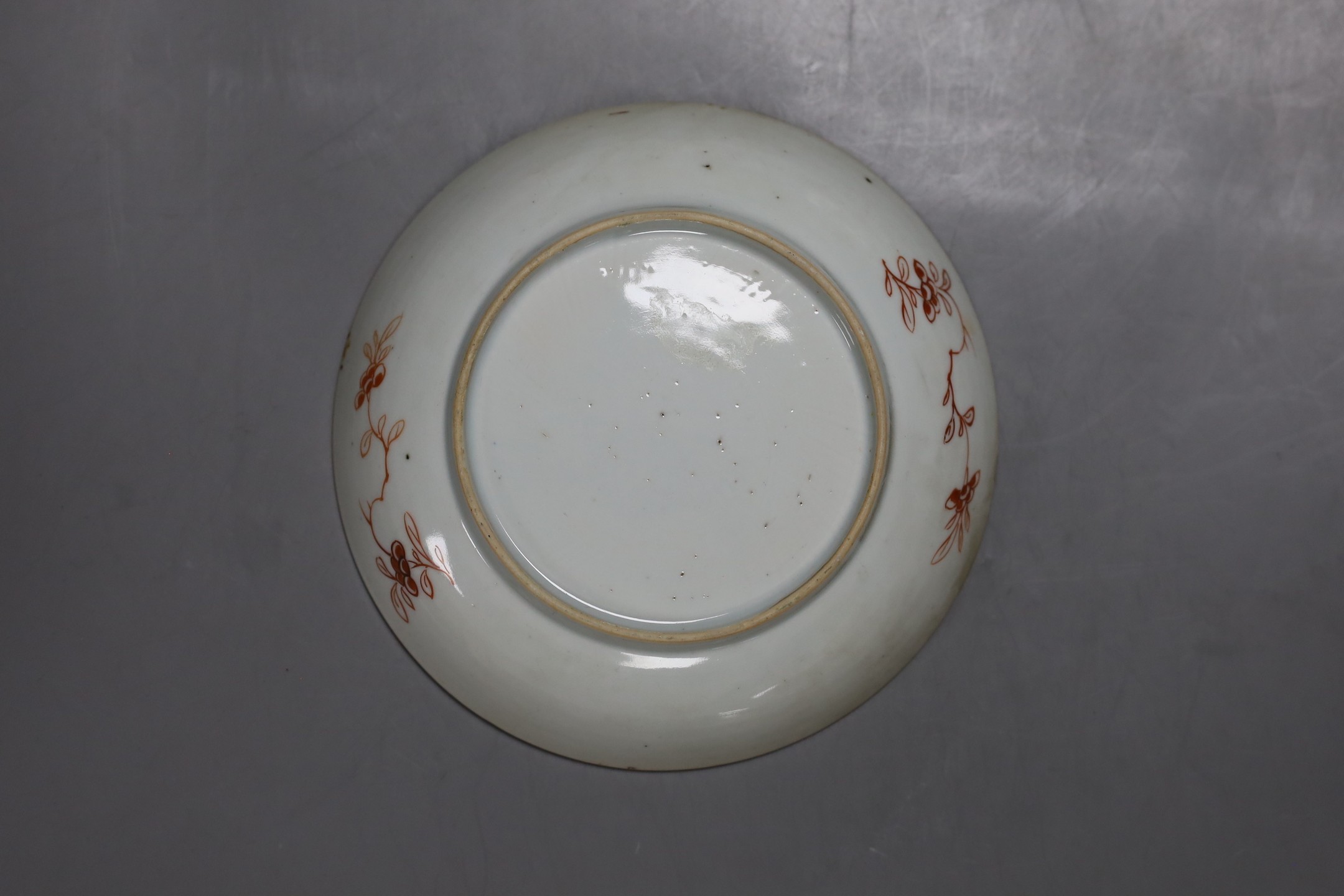 An 18th century Chinese export famille rose plate, similar saucer and an 18th century Chinese vert Imari plate, largest 22.5cm